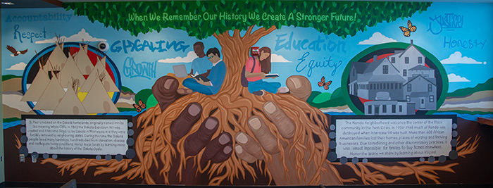 Mural at Saint Paul College; Large tree with text.