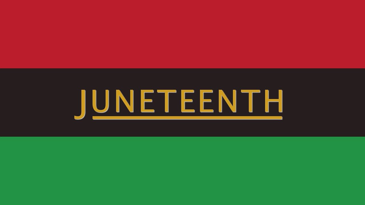 Juneteenth over red, brown and green flag