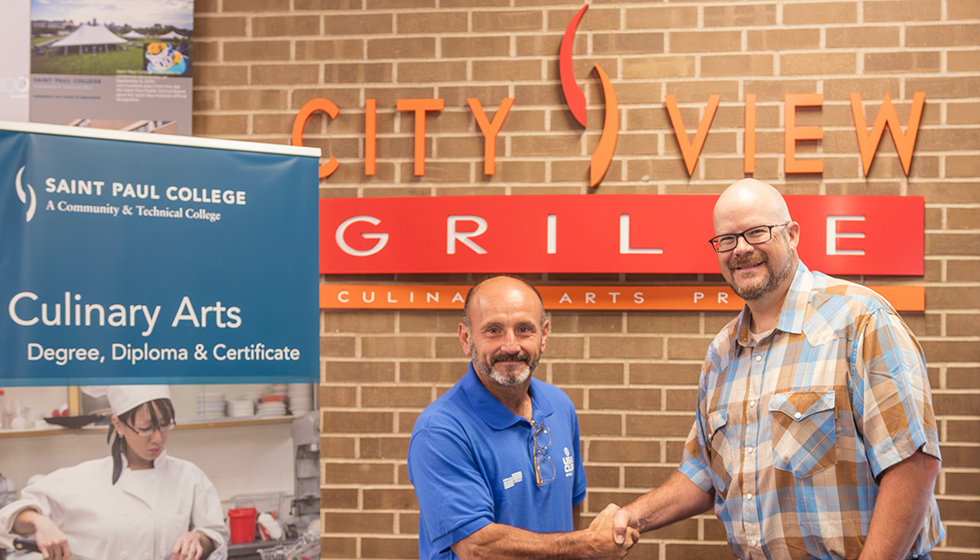 Pierre Rabbia and Ryan Siess in front of the City View Grille